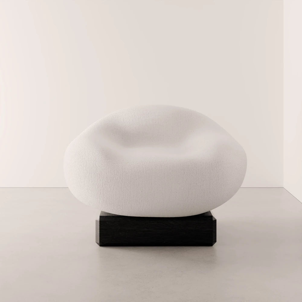 Front view of the Winter Powder Chair by Antony Gasnier with a rounded white seat and dark solid oak base